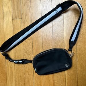 Lululemon Black and White cross body “belt bag” style bag in good condition